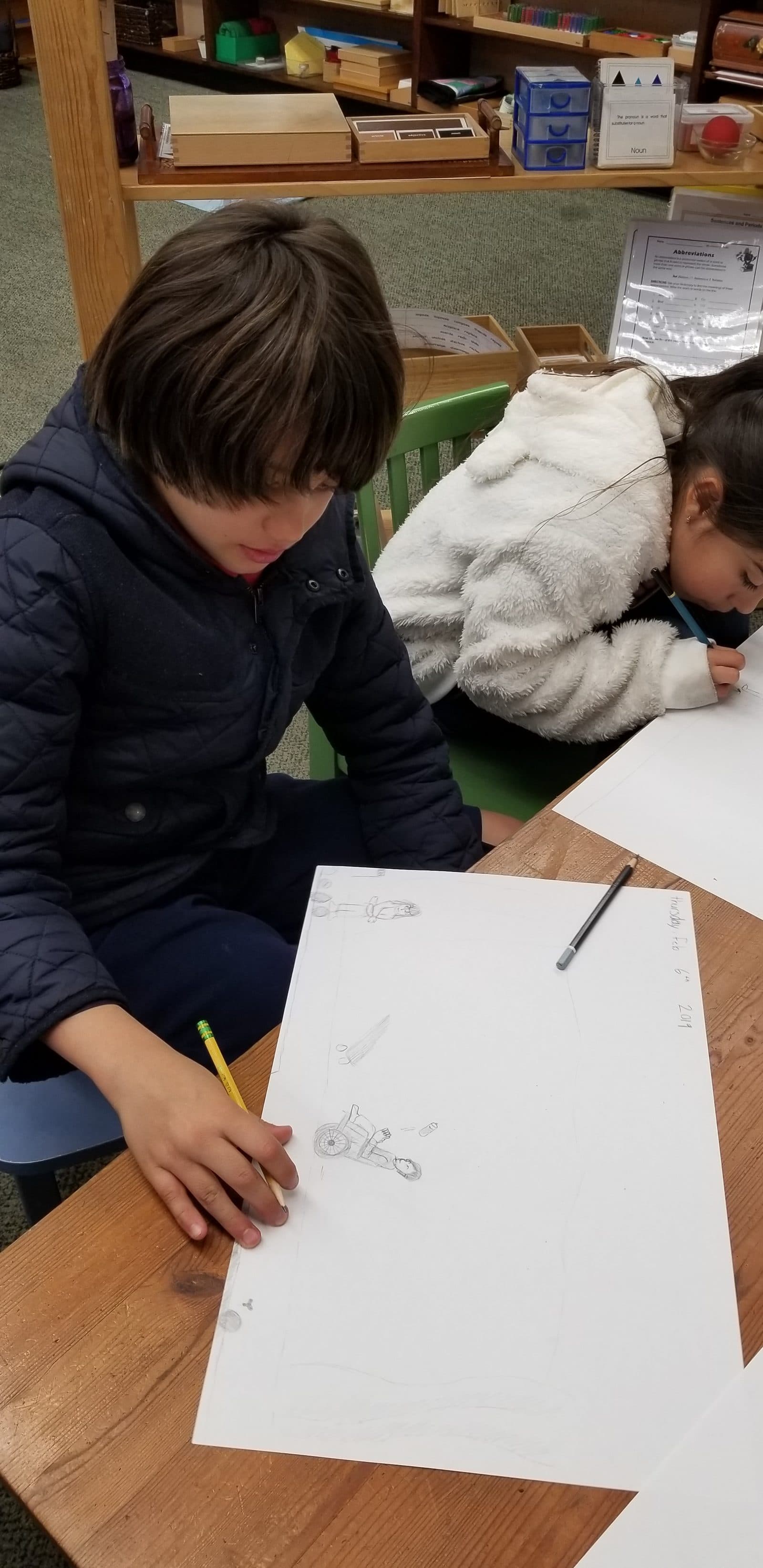 Elementary students drawing in the classroom